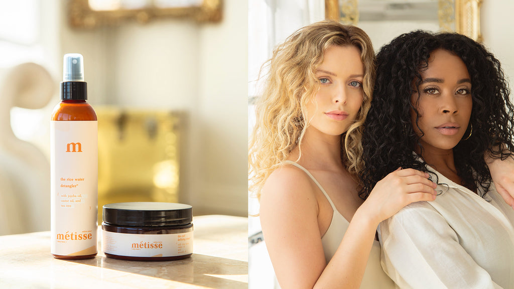 black girl and white girl with curly hair using metisse natura hair care line the duo coposed of the rice water detangler and the curl defining cream with castor oil and avocado oil and shea butter